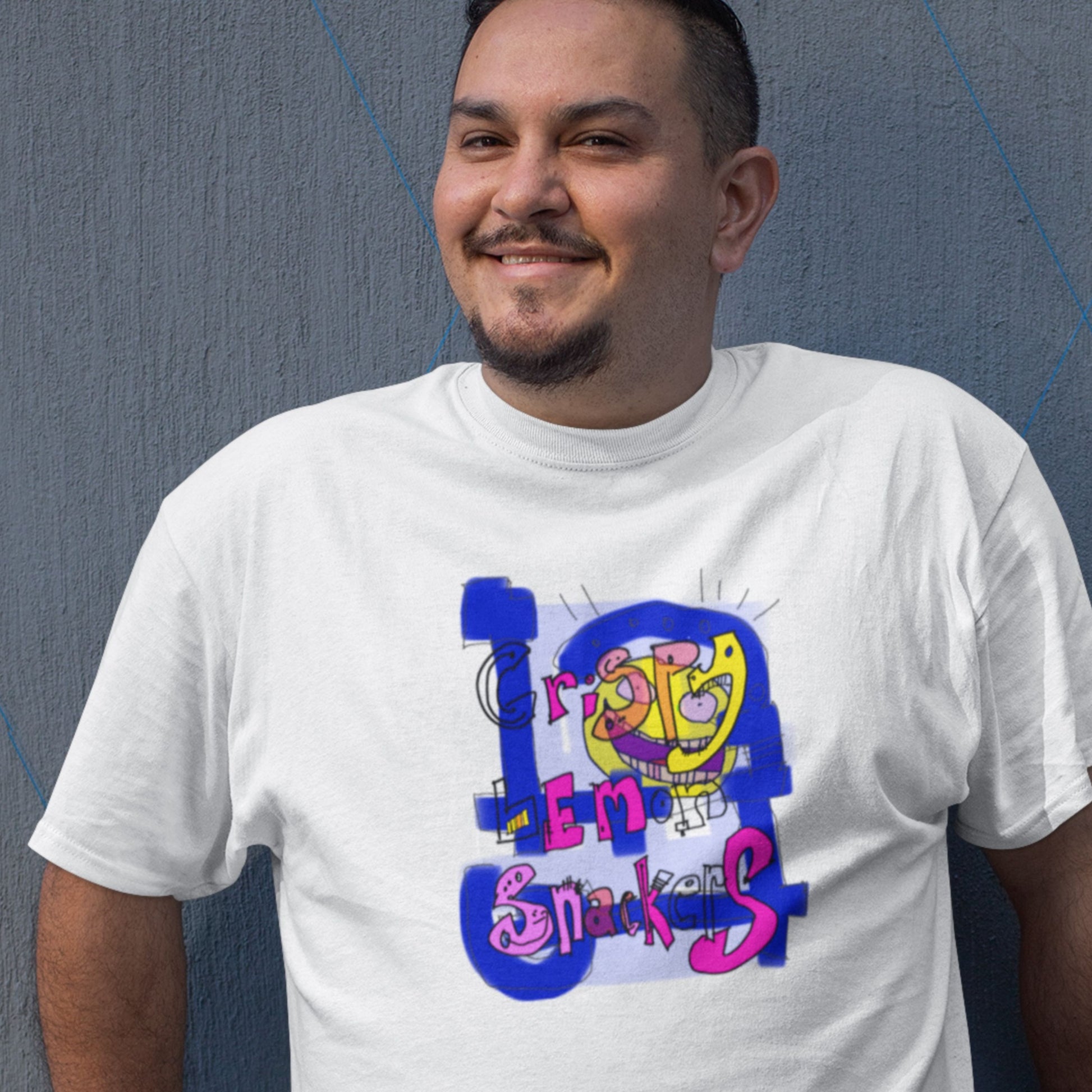 Man wearing a white t-shirt with a colorful abstract trash graff drawing on a grey background.