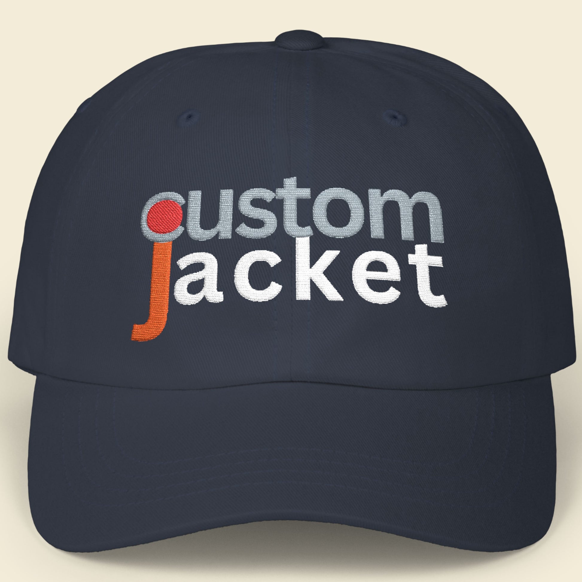 Navy blue cap with 'custom jacket' text on a beige background.