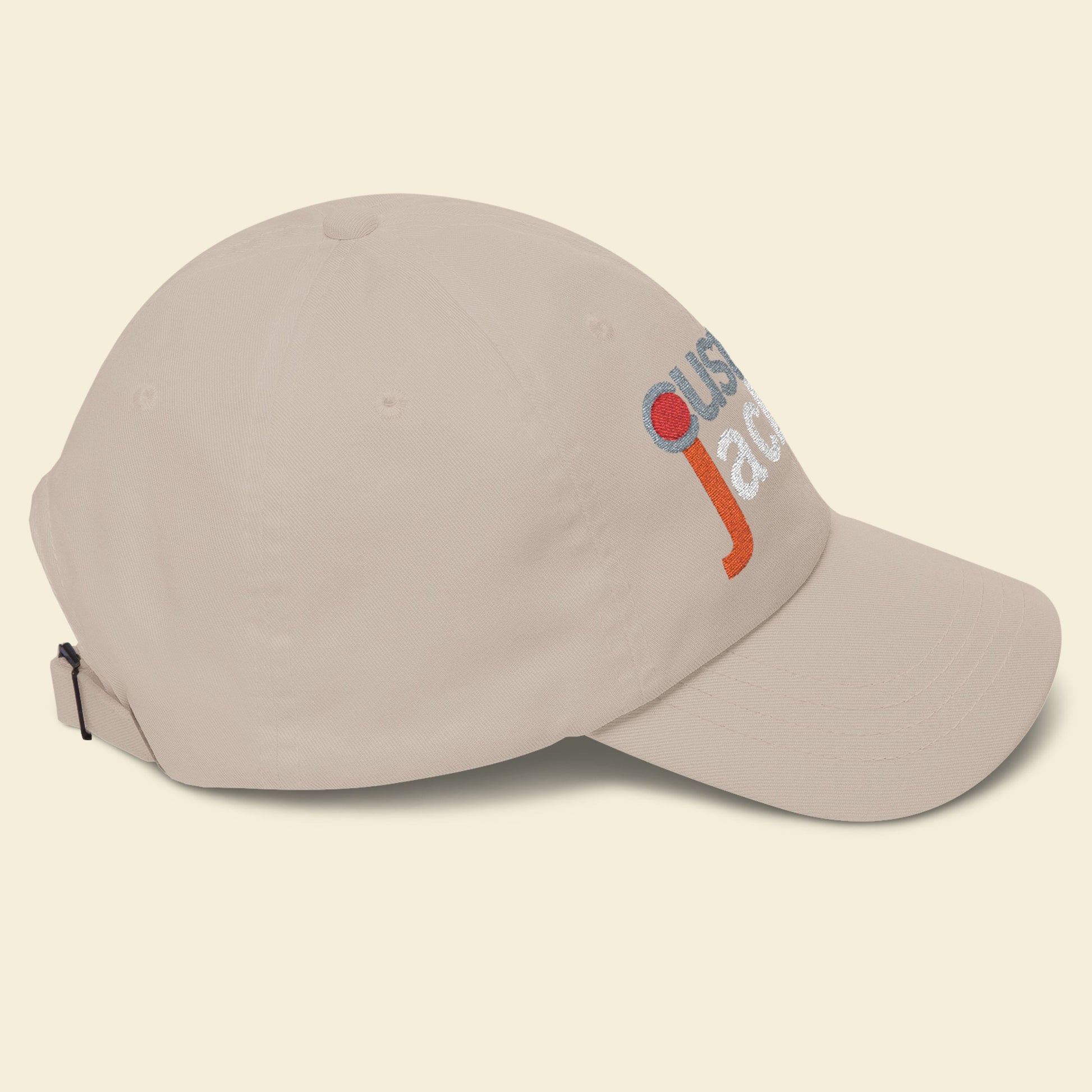 Beige cap with a colorful logo on a beige background.