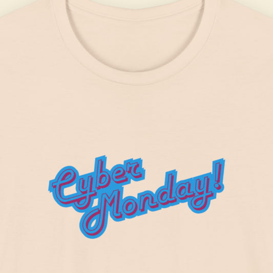 Beige t-shirt with multicolored 'Cyber Monday!' text on a beige background.