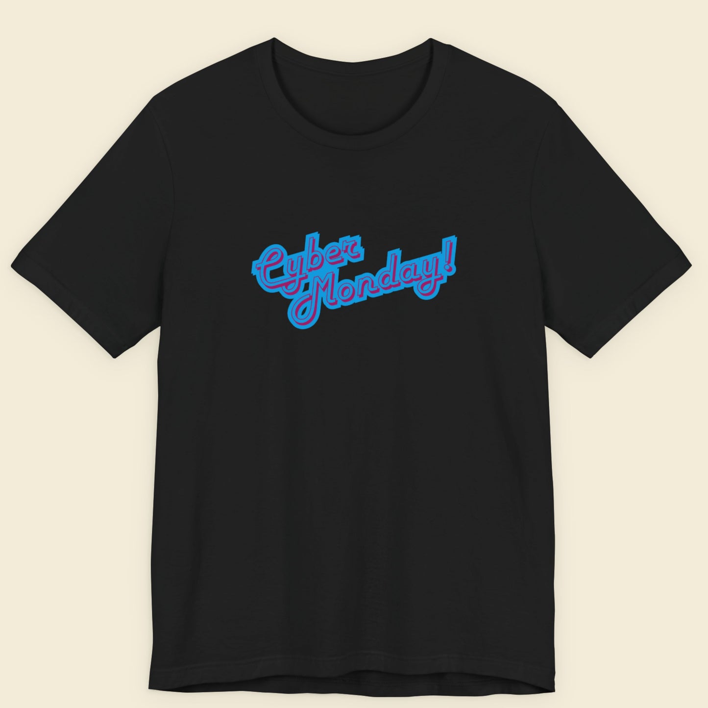 Black t-shirt with multicolored 'Cyber Monday!' text on a beige background.