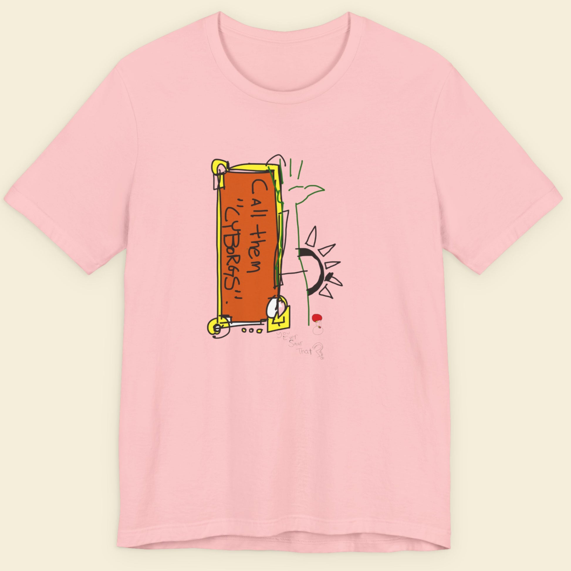 Pink t-shirt with a colorful graphic design on a beige background.