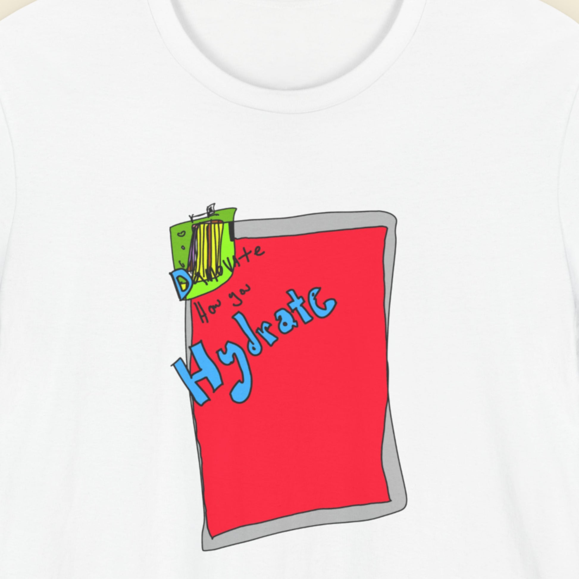 White t-shirt with a colorful abstract drawing on a beige background.