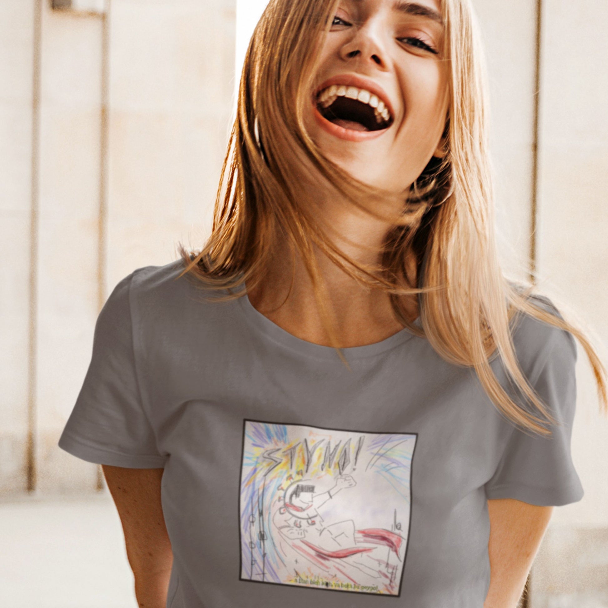 Woman wearing a grey t-shirt featuring the colorful album cover for Styho!