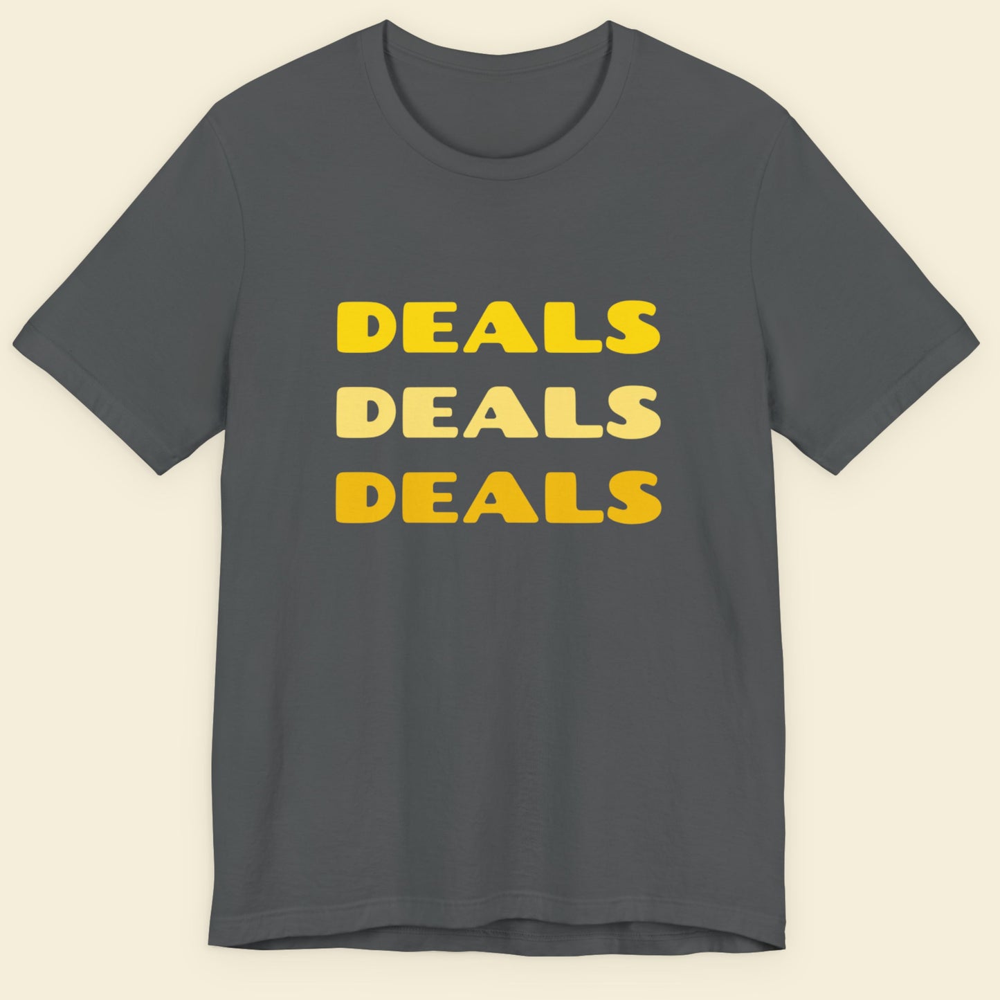 Gray t-shirt with 'DEALS DEALS DEALS' text in yellow on a beige background.