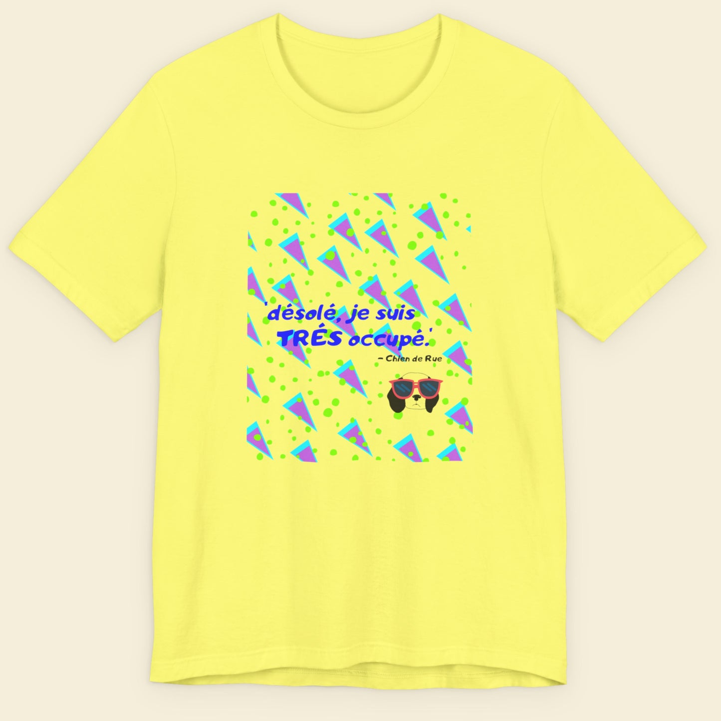 Yellow t-shirt with a fun, colorful 90's era cartoon illustration on a beige background.