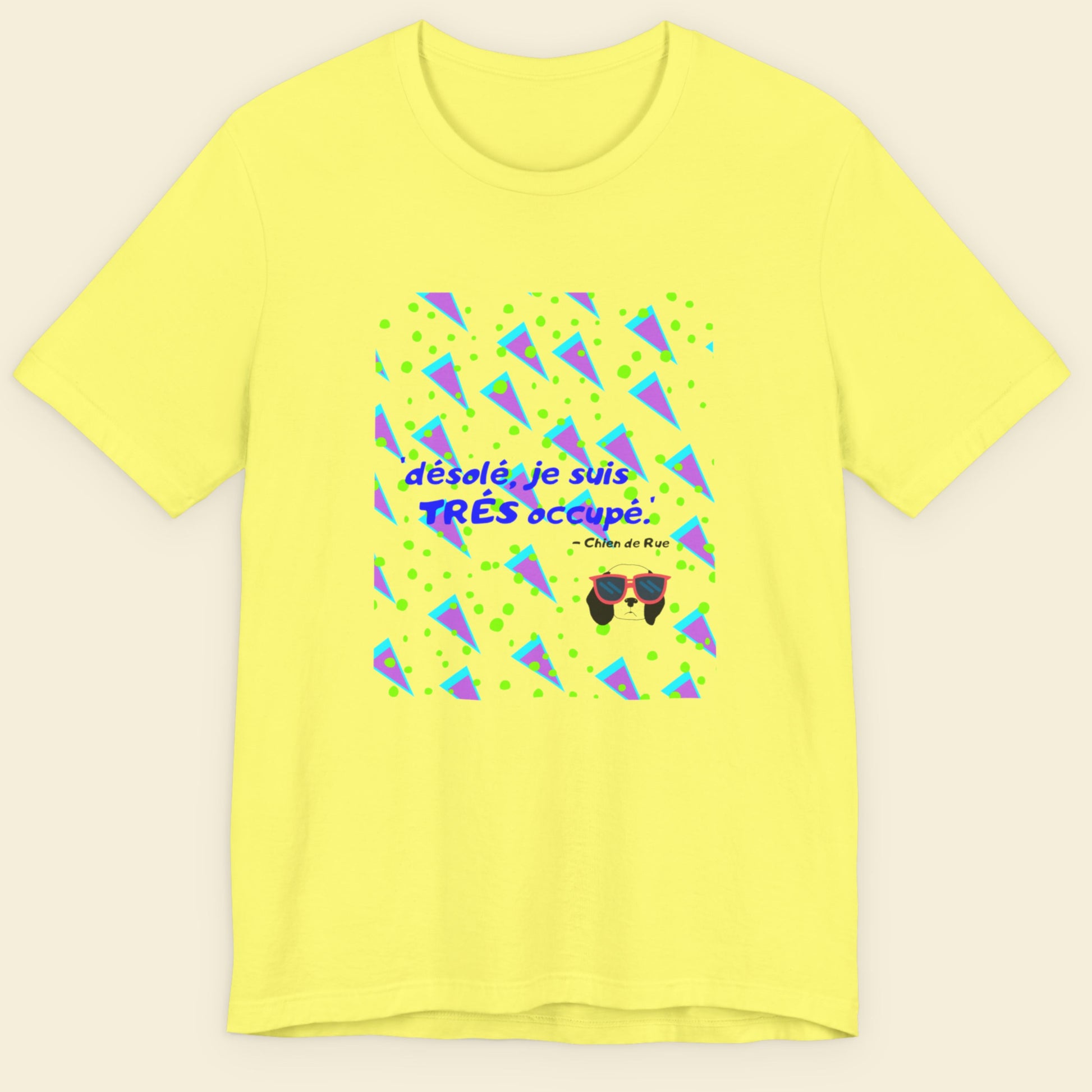 Yellow t-shirt with a fun, colorful 90's era cartoon illustration on a beige background.