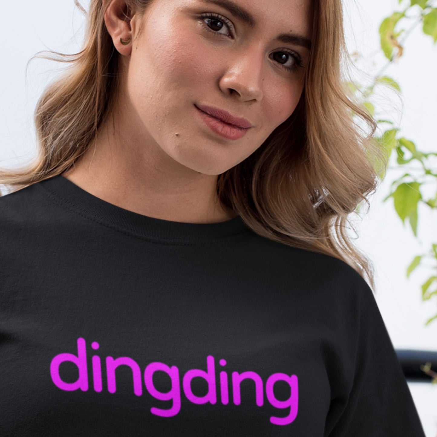 Black shirt with purple text reading 'dingding' worn by a model
