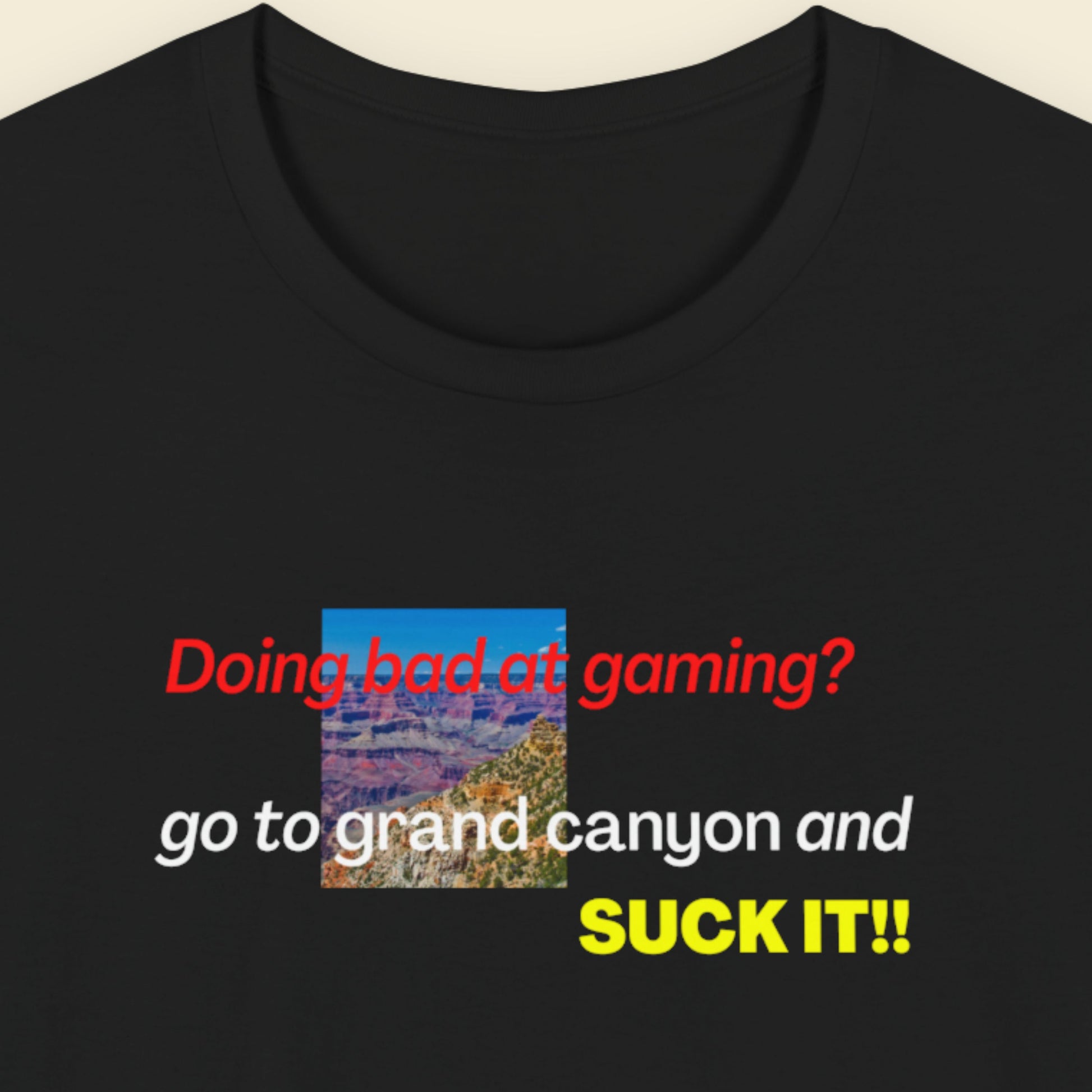 Black t-shirt with colorful text and a small image of the Grand Canyon.