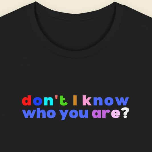 Black t-shirt with colorful text 'don't I know who you are?' on a beige background.