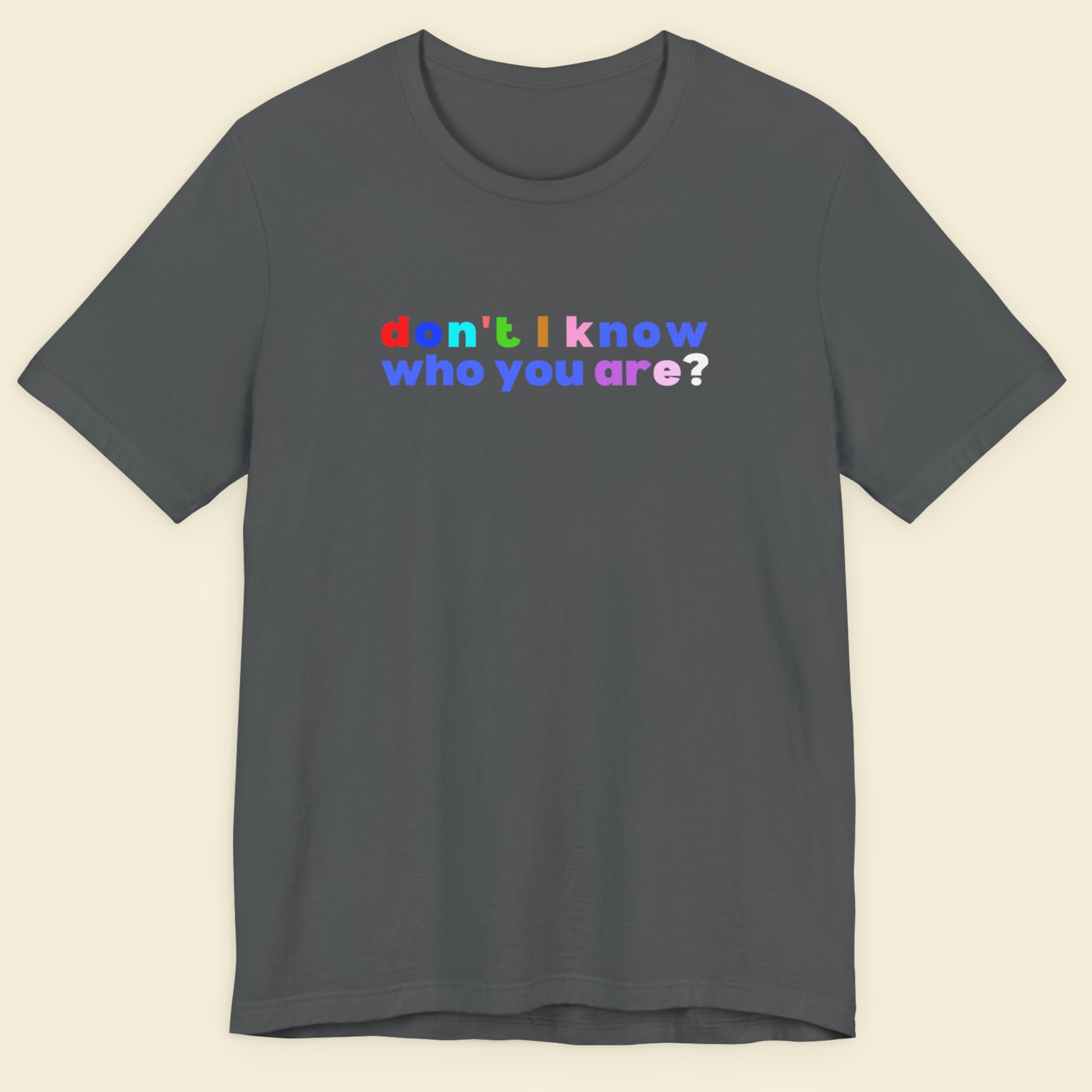Gray t-shirt with colorful text 'don't I know who you are?' on a beige background.