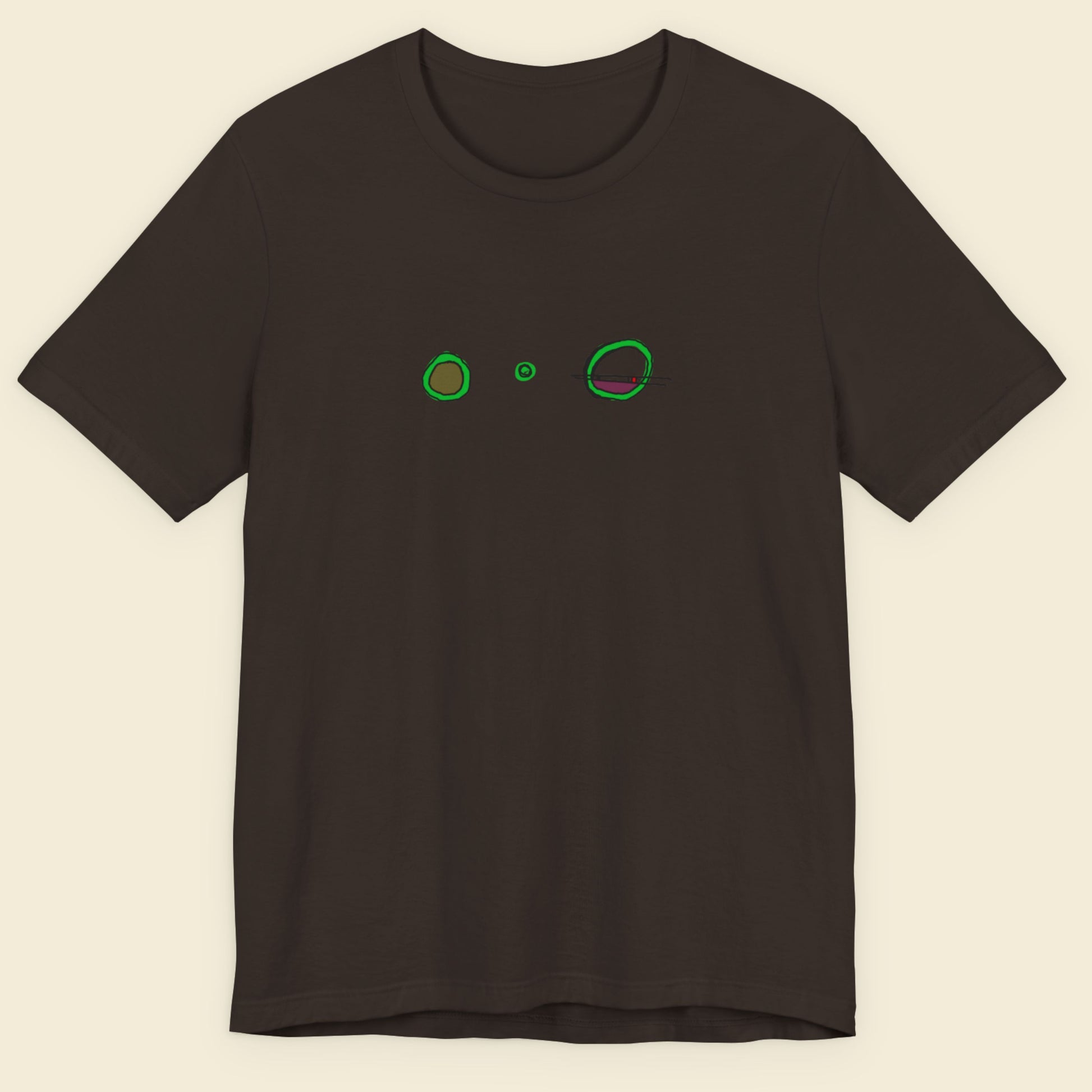 Brown t-shirt with a colorful abstract drawing on a beige background.