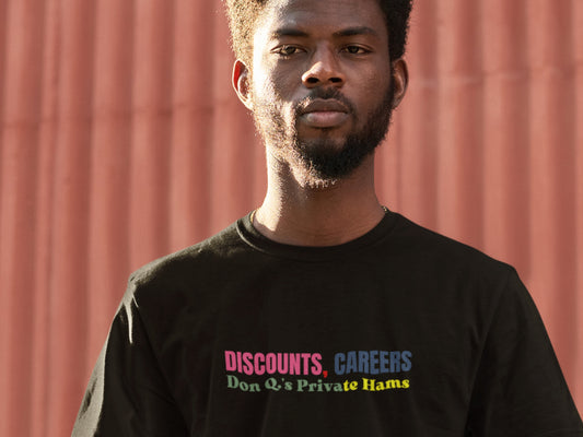 Man wearing a black t-shirt with colorful text against a red background