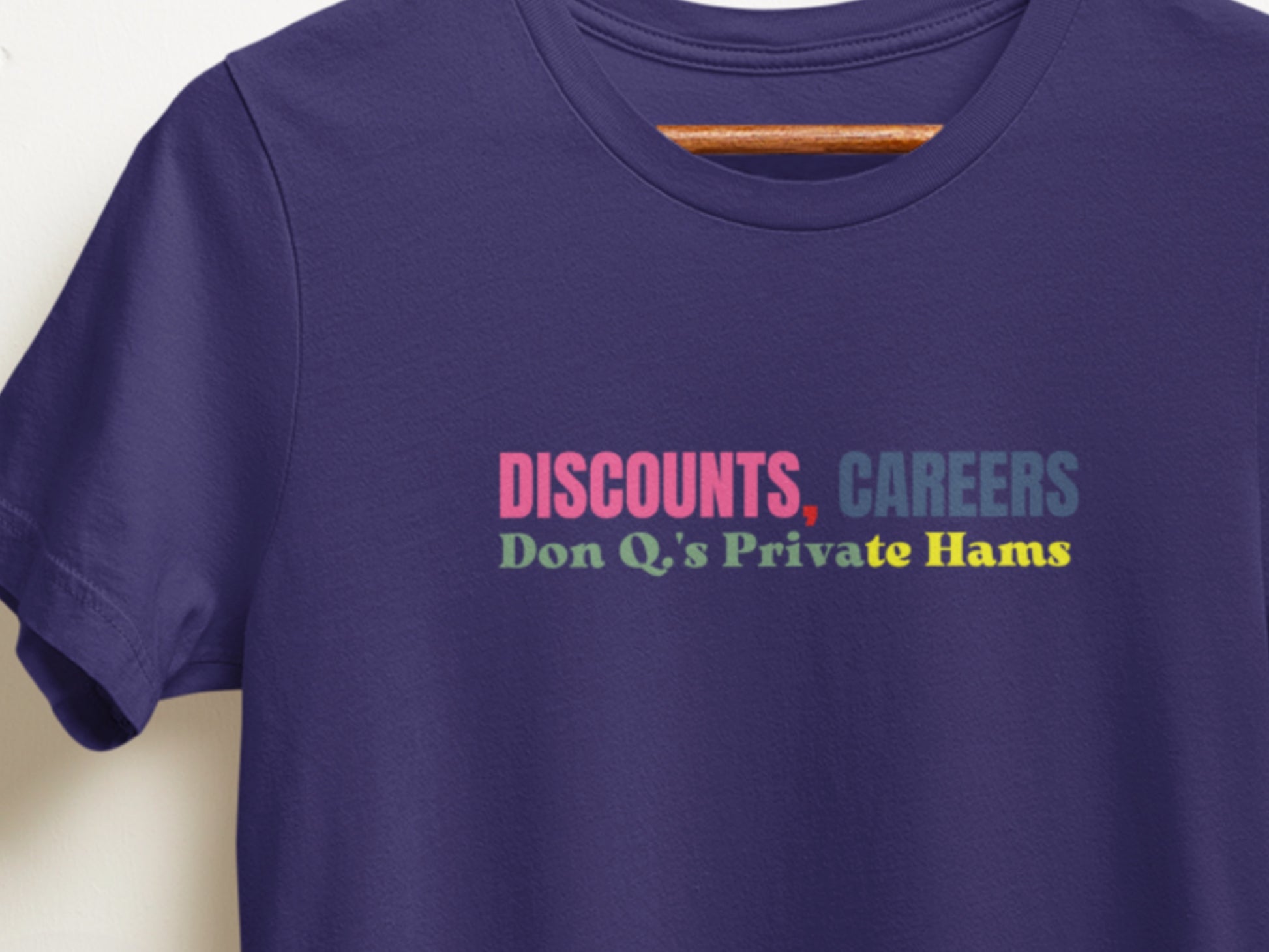 Navy t-shirt with colorful text on a white background