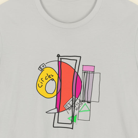 Grey t-shirt with a colorful abstract drawing on a beige background.