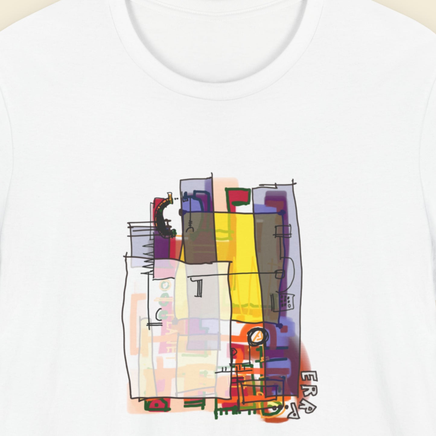 White t-shirt with a colorful abstract diagram drawing on a beige background.