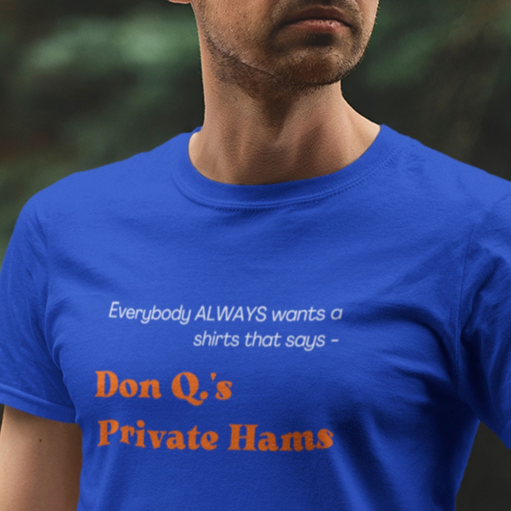 Person wearing a blue t-shirt with humorous text design.
