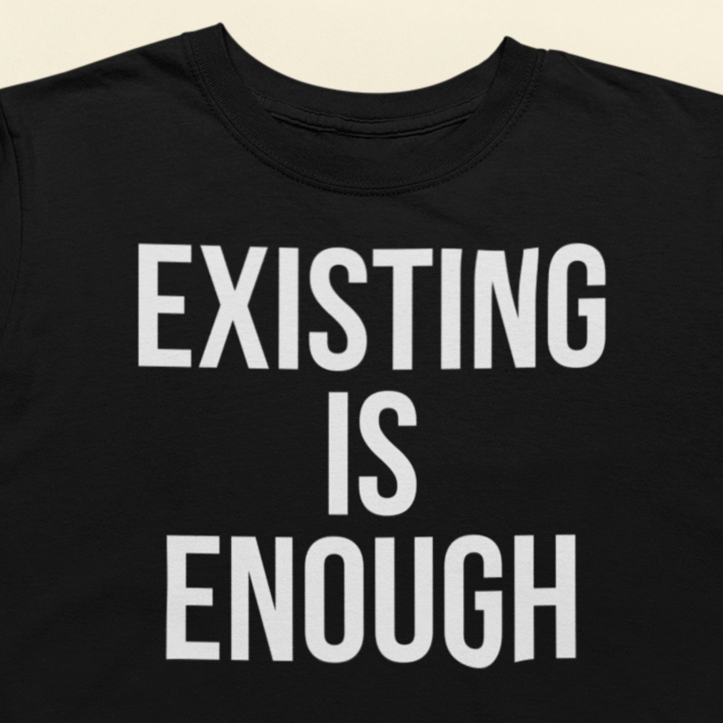 Existing is enough text t-shirt black minimalist design closeup