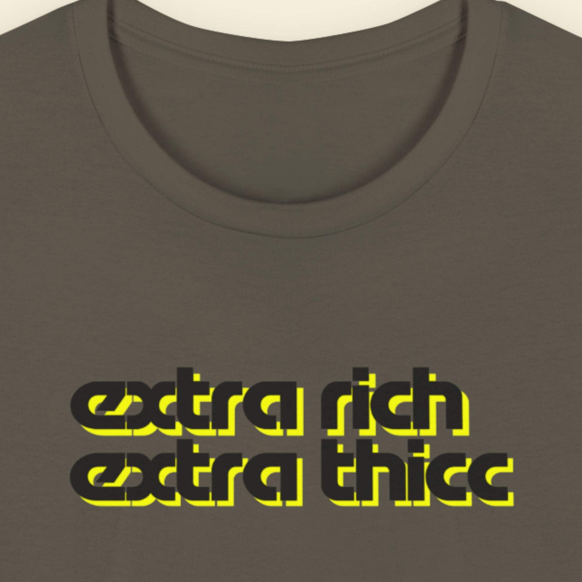 Army green t-shirt with 'extra rich extra thicc' text in black and yellow on a beige background.