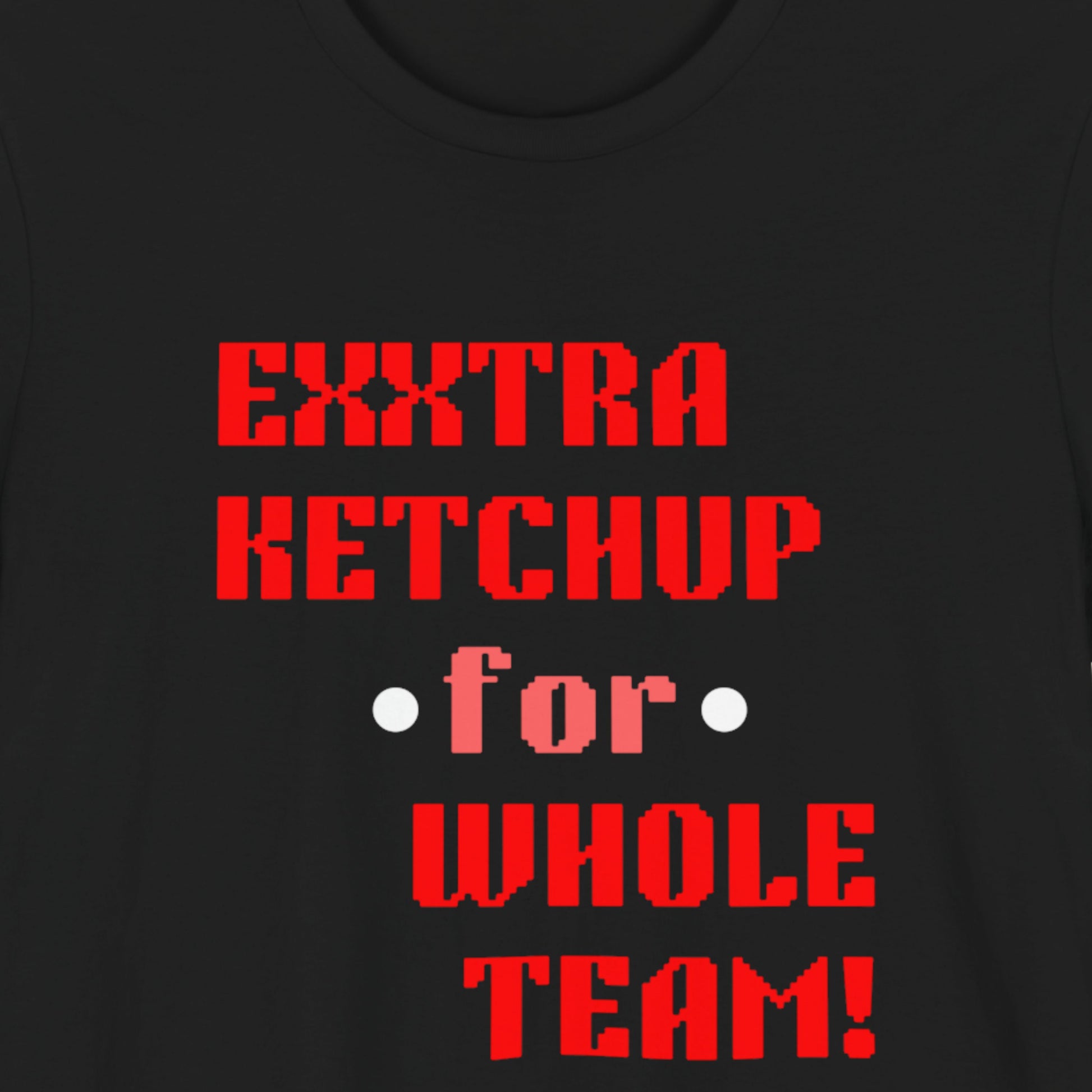 Black t-shirt with red text 'EXTRA KETCHUP for WHOLE TEAM!' on a plain background.