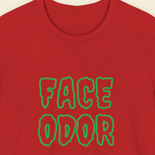 Red t-shirt with humorous colorful text on a beige background.