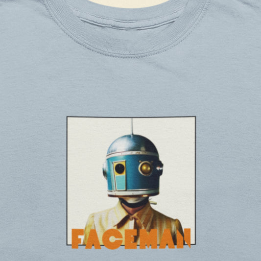 Light blue shirt featuring an image of a helmet wearing woman as Faceman, famous space musician