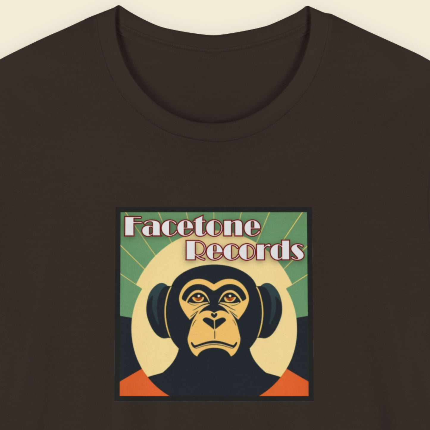 Black t-shirt with Facetone Records monkey logo on a beige background