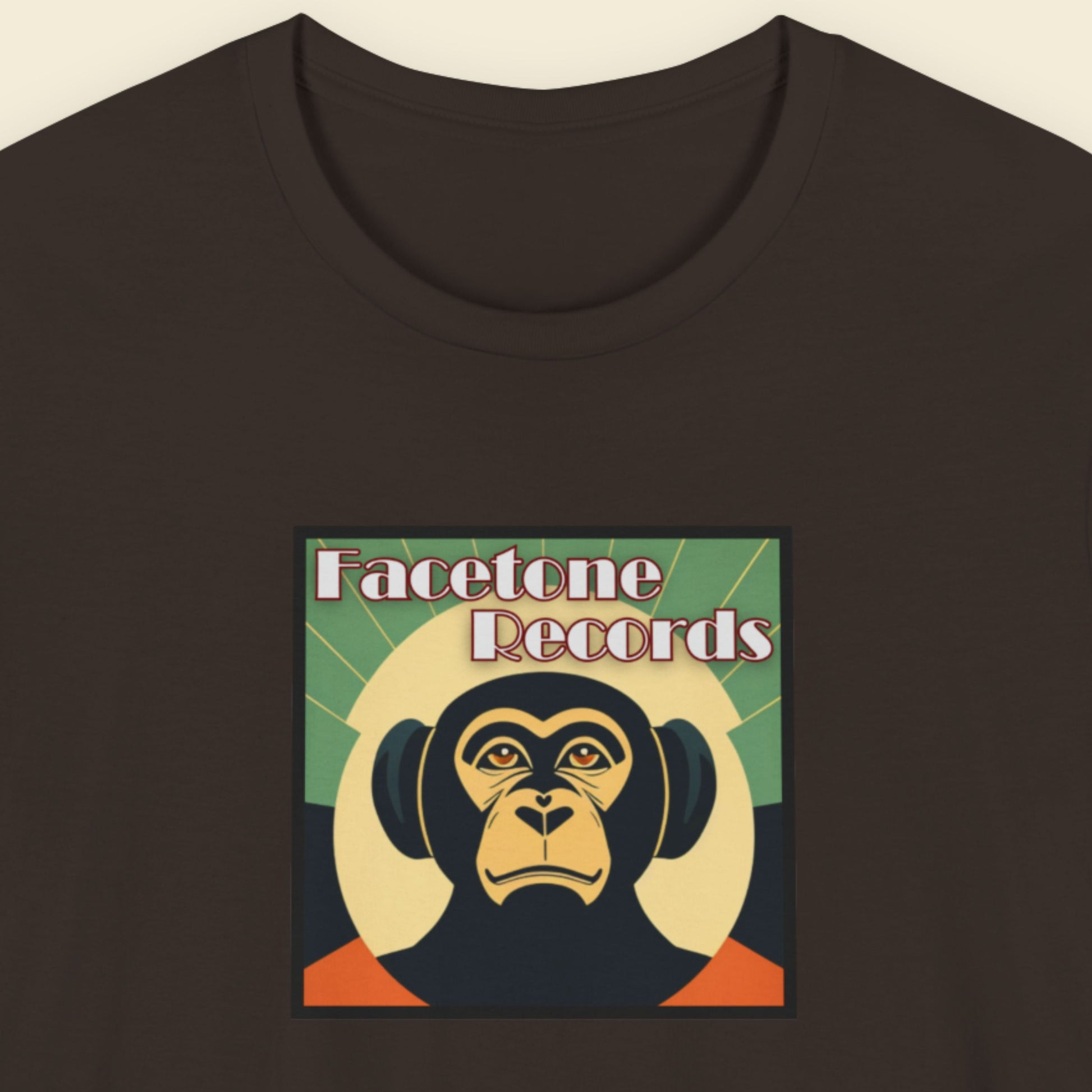 Black t-shirt with Facetone Records monkey logo on a beige background