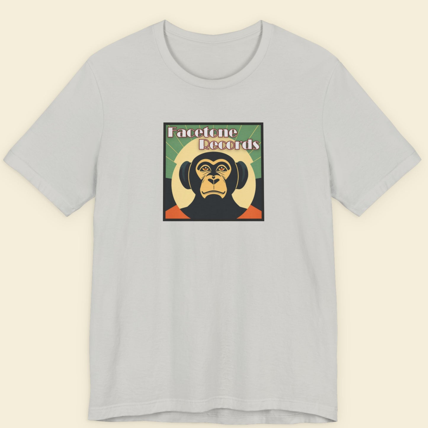 Gray t-shirt with a graphic of a monkey and text on a beige background