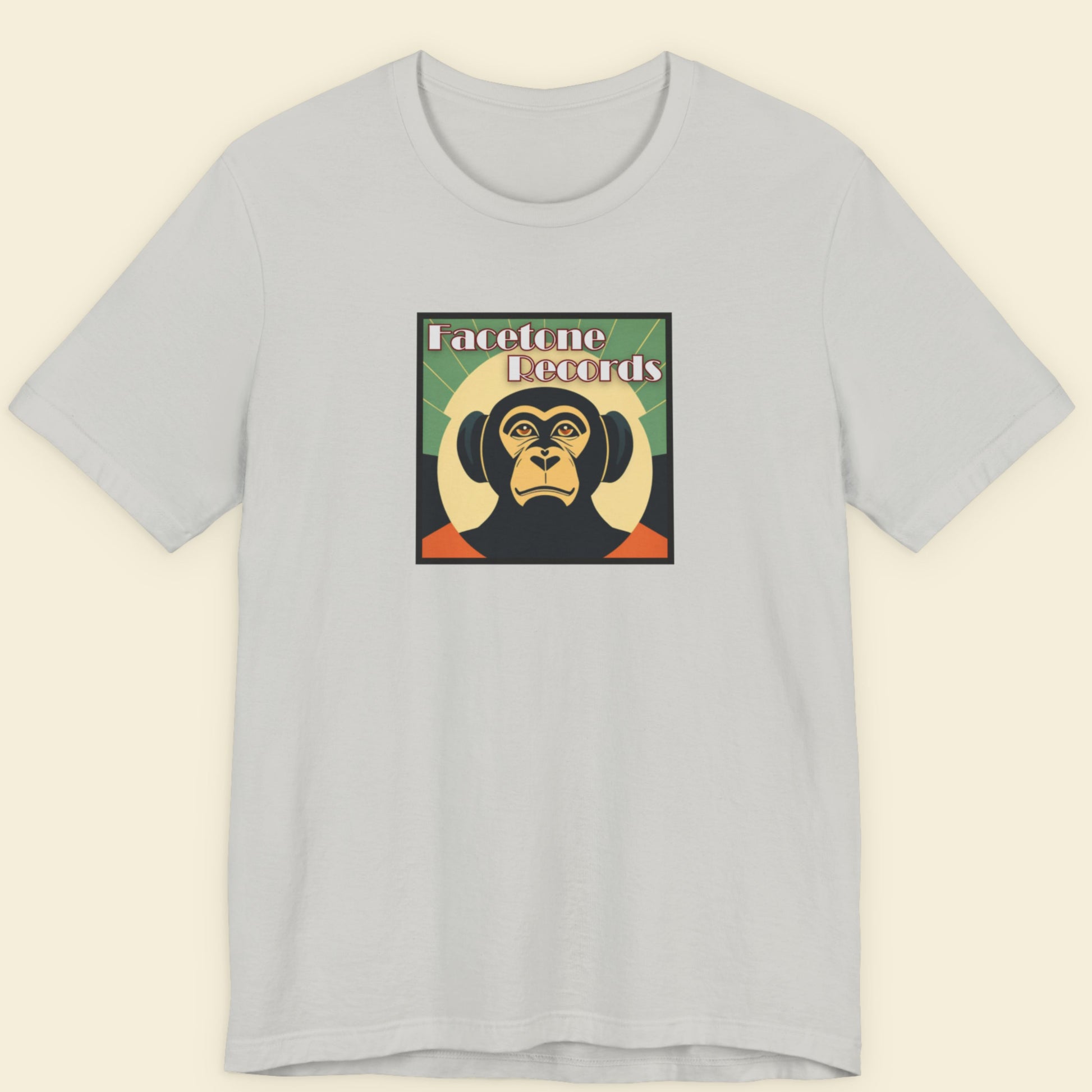 Gray t-shirt with a graphic of a monkey and text on a beige background