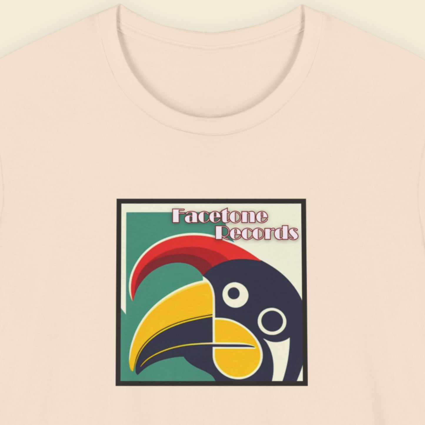 T-shirt with Facetone Records logo featuring a colorful toucan design on a beige background