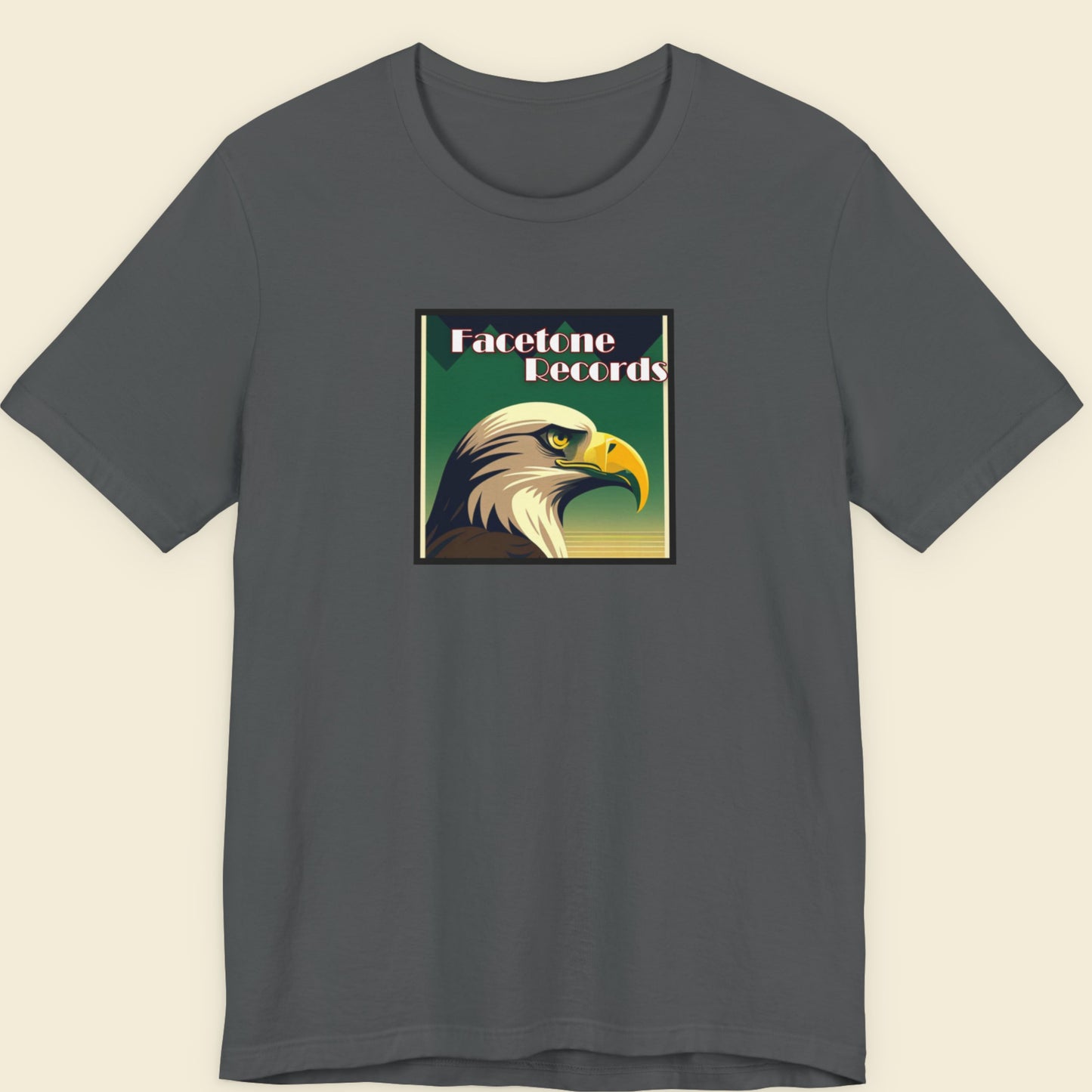 Gray t-shirt with an eagle graphic and 'Facetone Records' text on a beige background