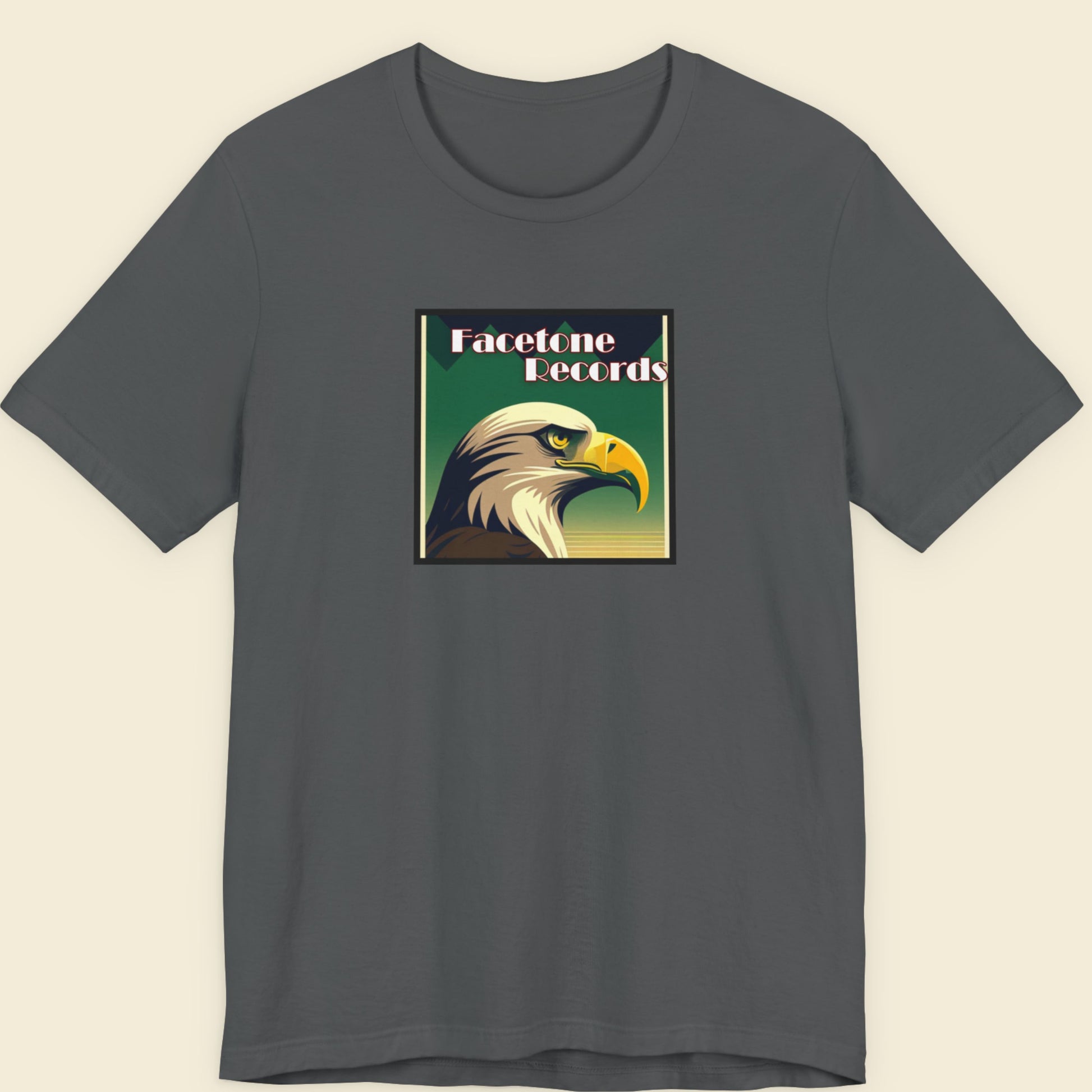 Gray t-shirt with an eagle graphic and 'Facetone Records' text on a beige background