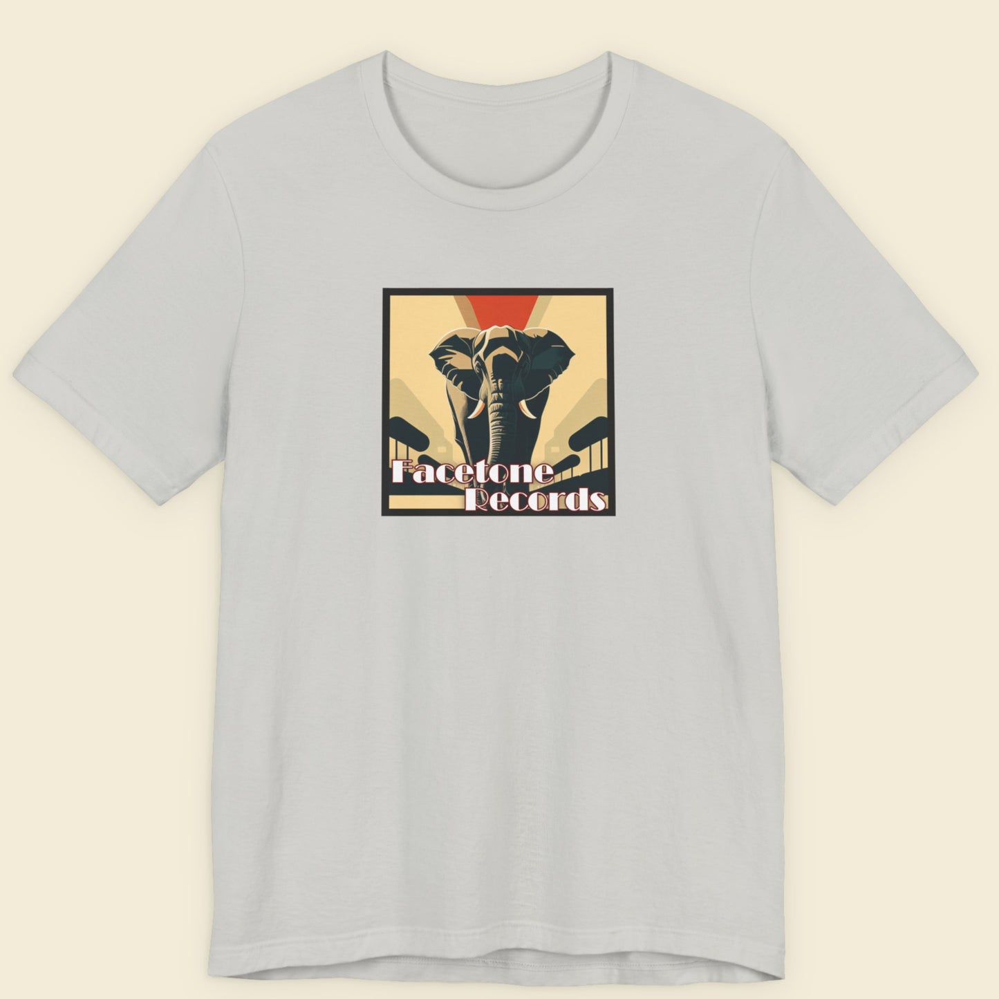 Light gray t-shirt with a graphic design of an elephant and text on a beige background