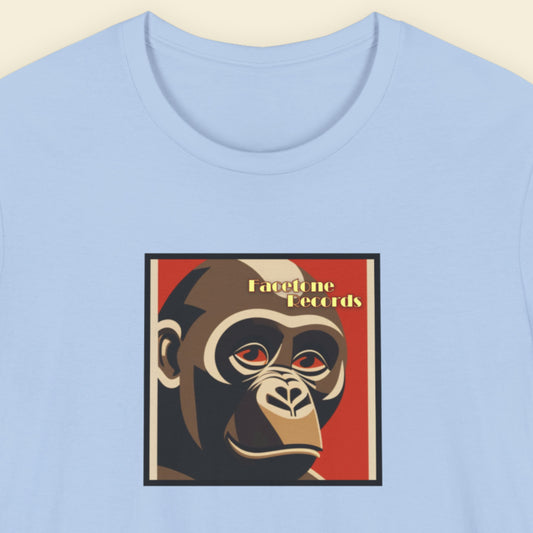 Light blue t-shirt with a graphic of a monkey's face and 'Facetone Records' text on a red background.