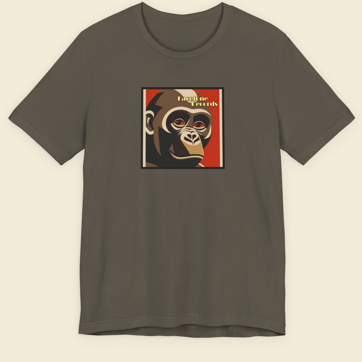Gray t-shirt with a graphic of a monkey's face on a beige background