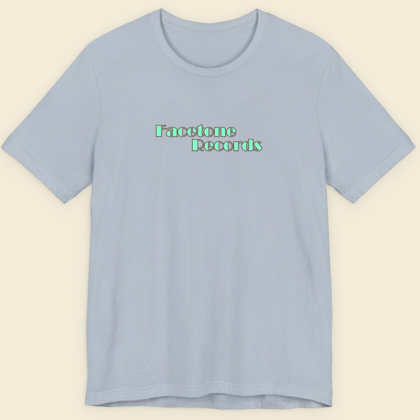 Light blue t-shirt with 'Facetone Records' text on a beige background