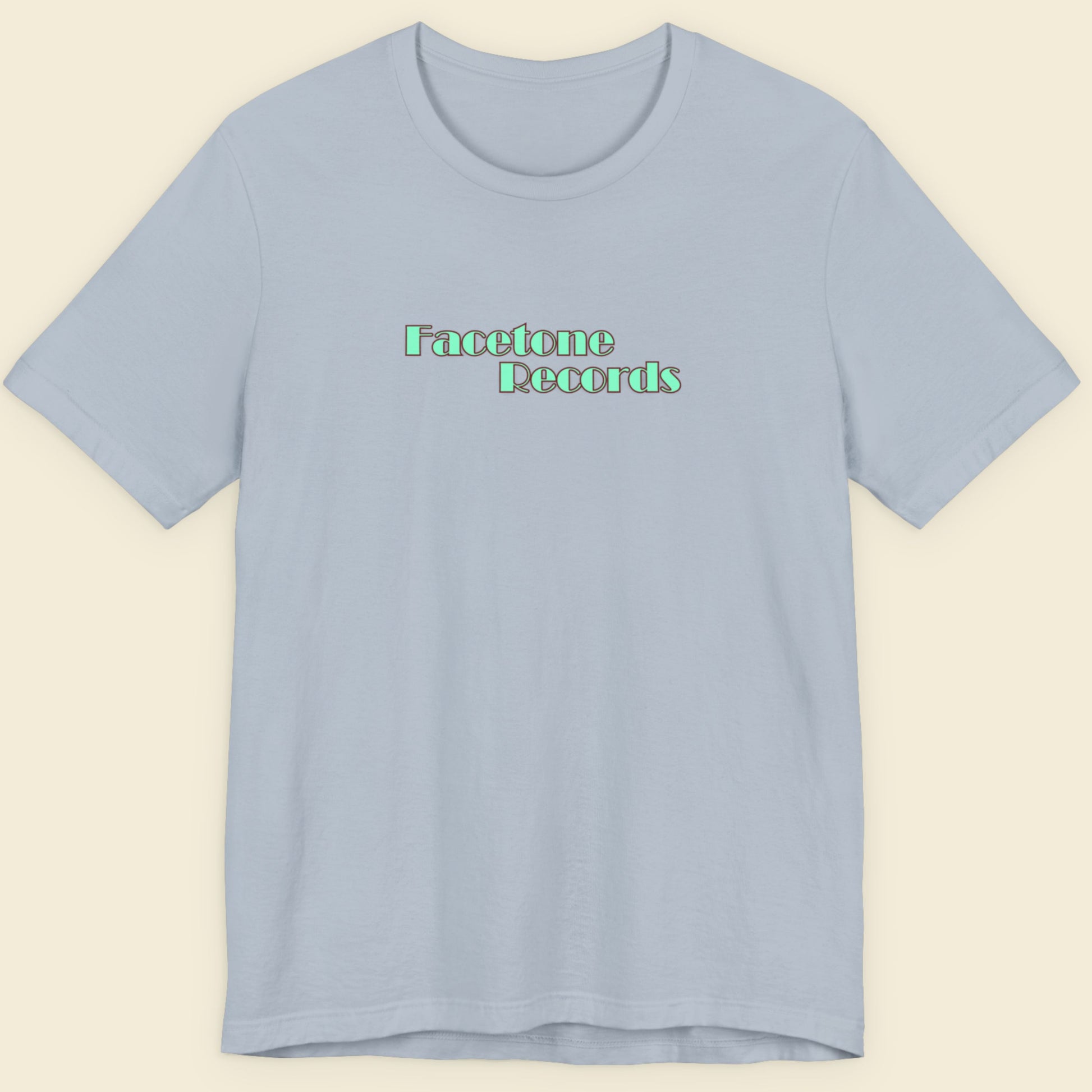Light blue t-shirt with 'Facetone Records' text on a beige background