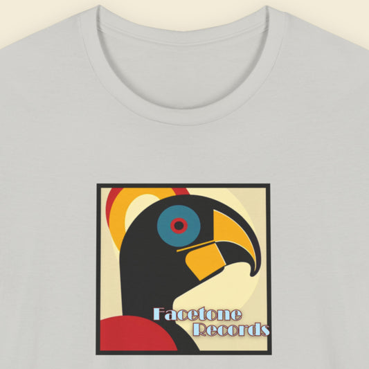 T-shirt with a colorful hornbill design and 'Facetone Records' text on a light gray background