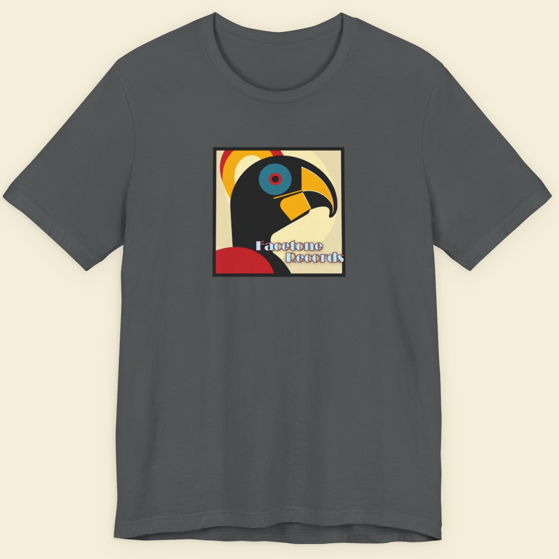 Gray t-shirt with a colorful hornbill 
graphic and text on a beige background
