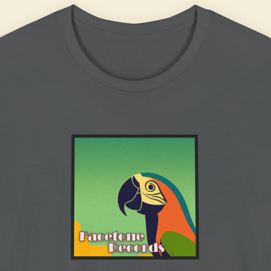 Gray t-shirt with a colorful parrot graphic and 'Facetone Records' text on a beige background
