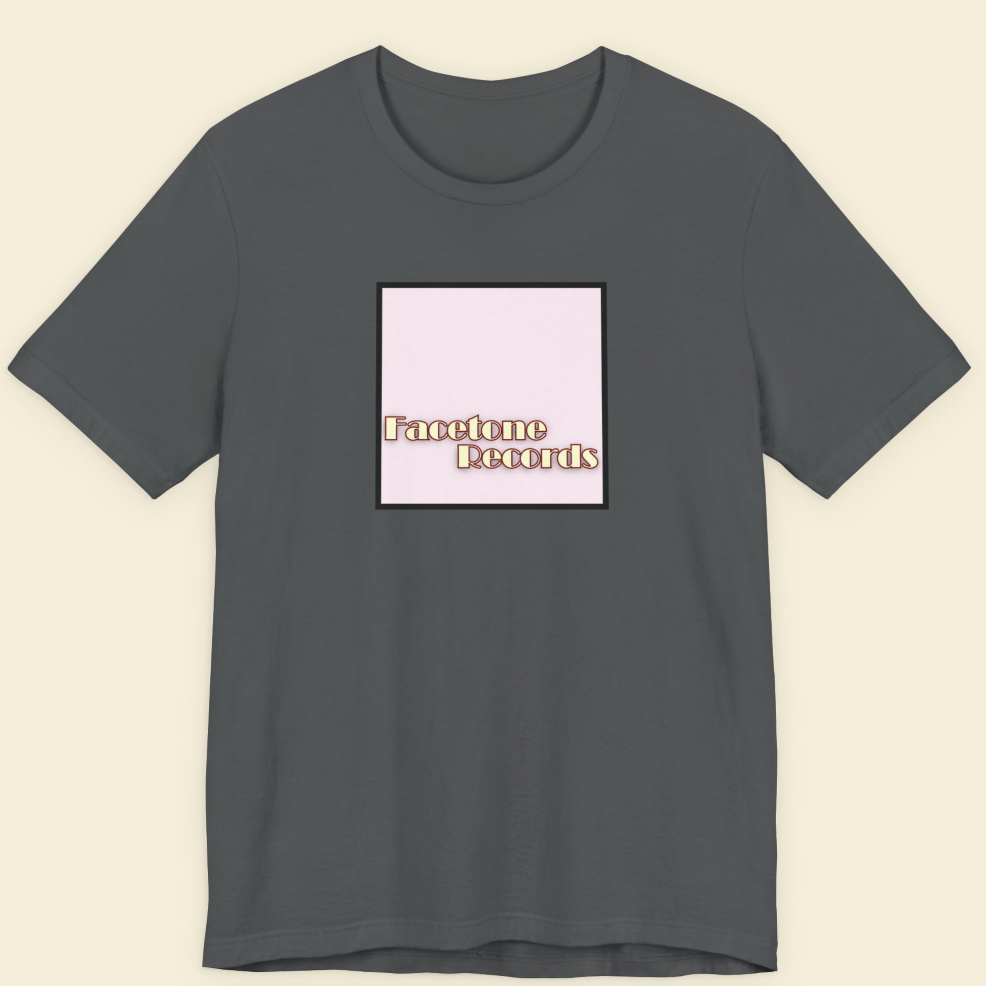 Gray t-shirt with 'Facetone Records' logo on a beige background