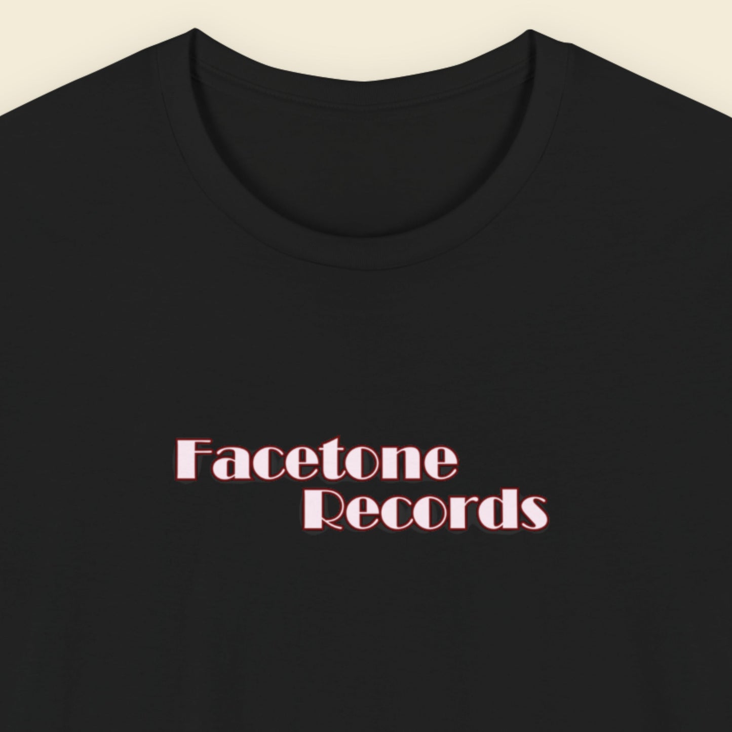 Black t-shirt with 'Facetone Records' text in red on a beige background