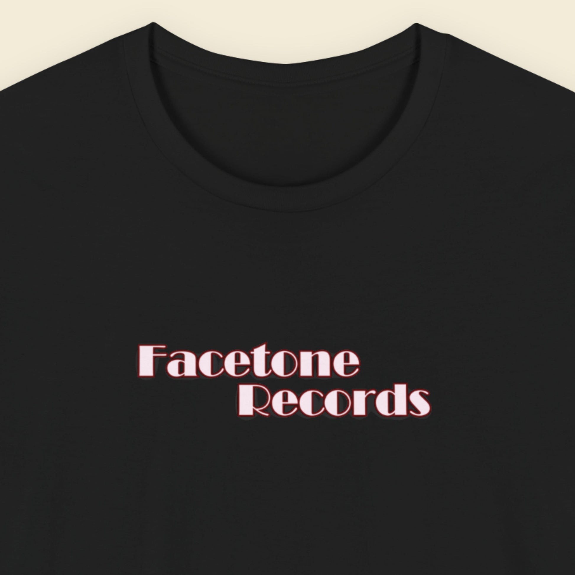 Black t-shirt with 'Facetone Records' text in red on a beige background