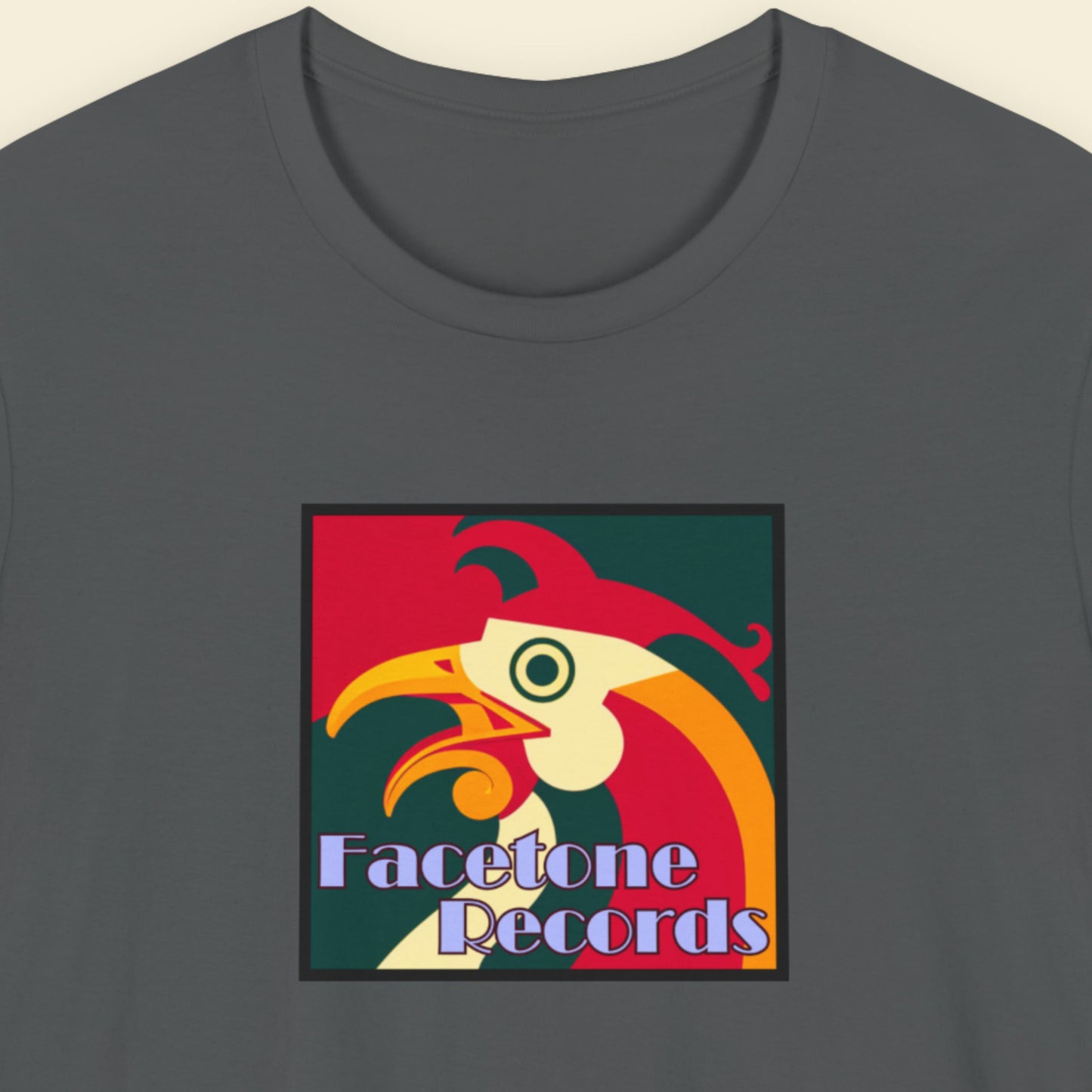 Gray t-shirt with a colorful rooster graphic and 'Facetone Records' text on a beige background