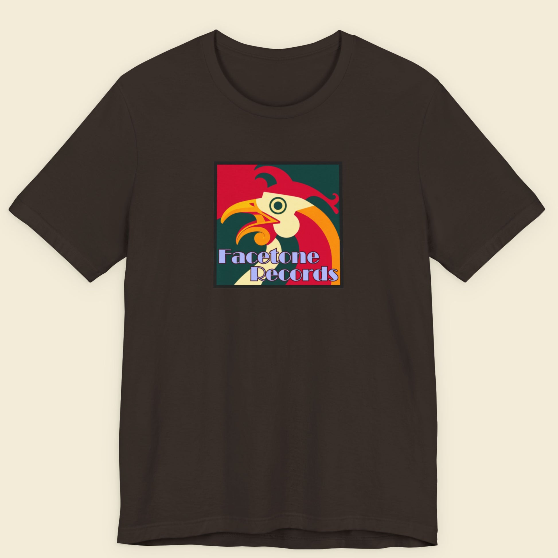 Black t-shirt with colorful rooster graphic and 'Facetone Records' text on a beige background