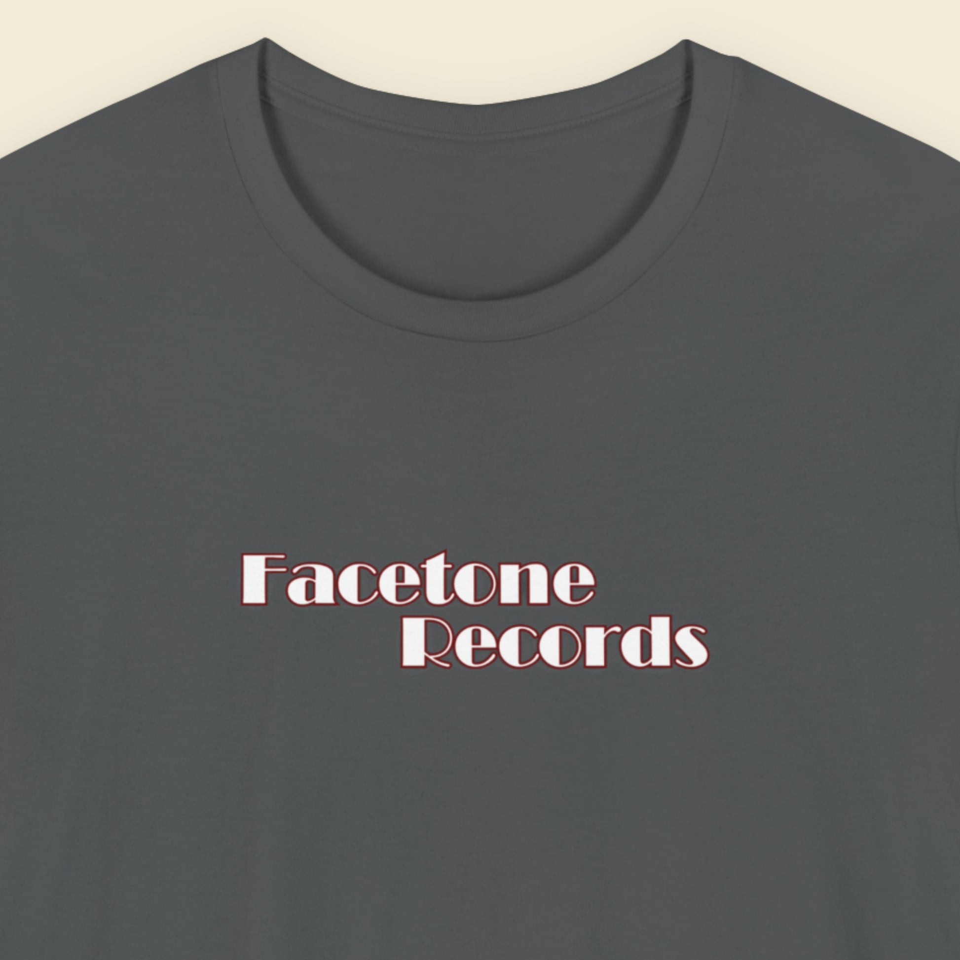 Dark gray t-shirt with 'Facetone Records' text on a beige background