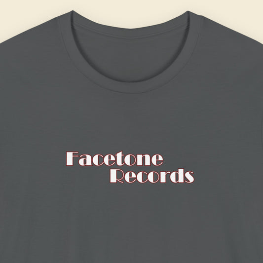 Dark gray t-shirt with 'Facetone Records' text on a beige background