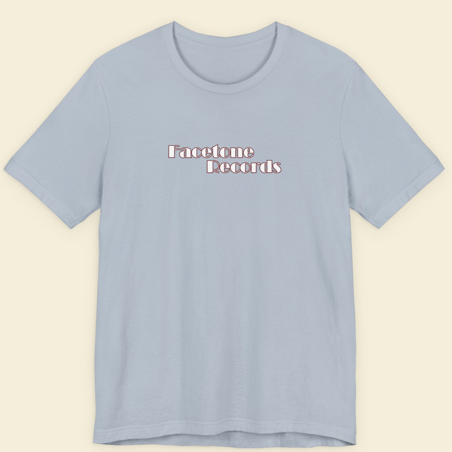 Light blue t-shirt with 'Facetone Records' text on a beige background