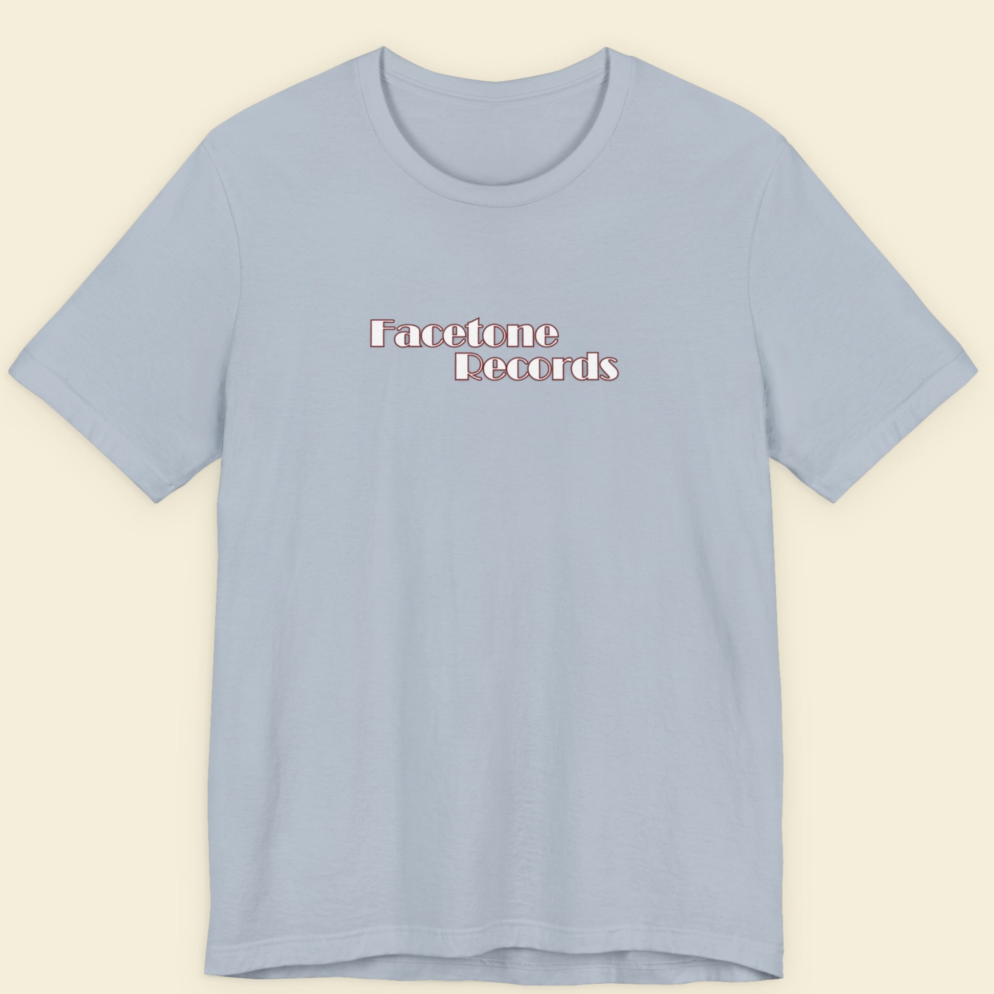 Light blue t-shirt with 'Facetone Records' text on a beige background